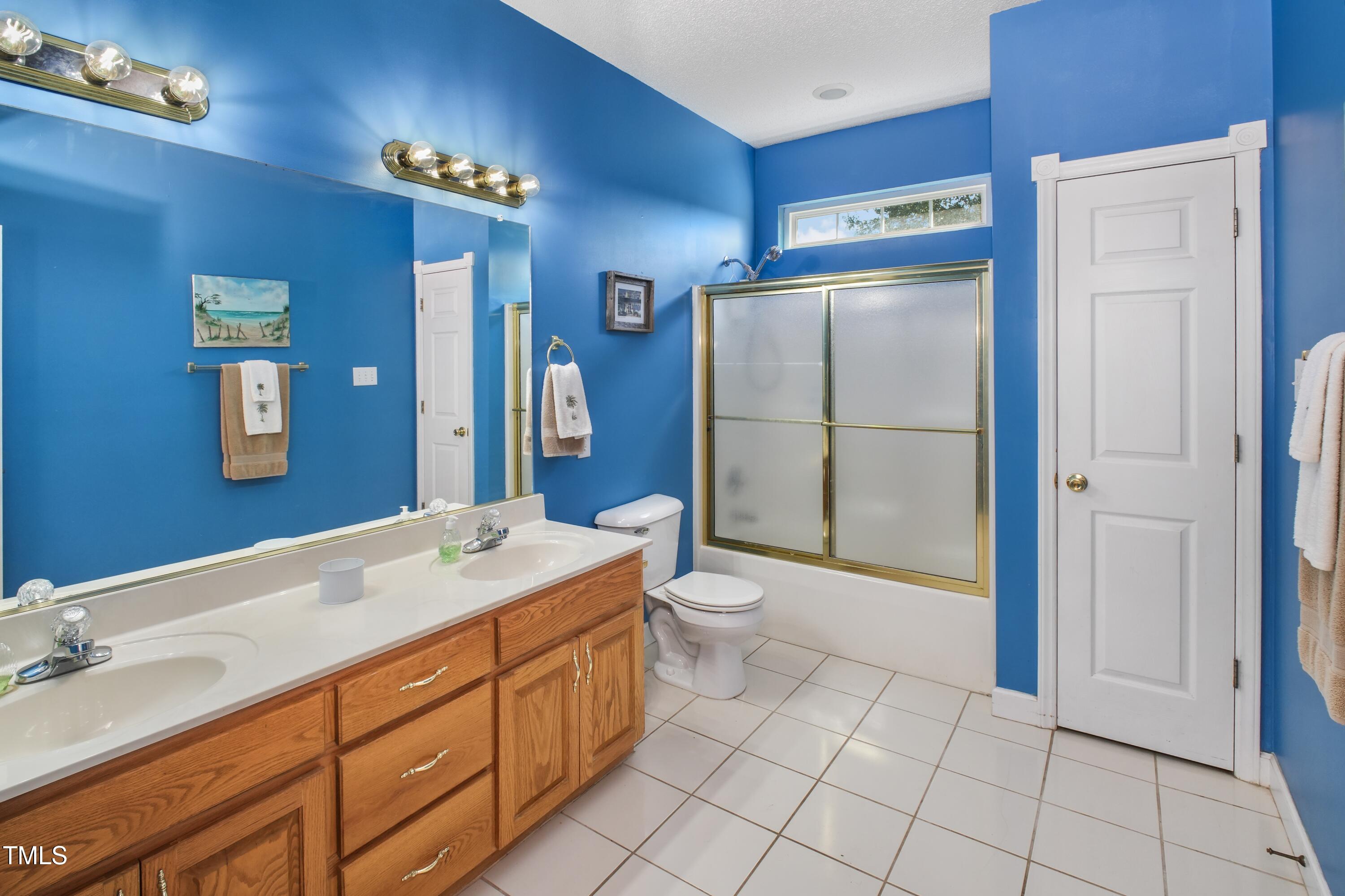 115 Hunters Walk Lane Clinton, NC 28328 - Photo 32 of 39 a spacious bathroom with a sink a toilet and shower