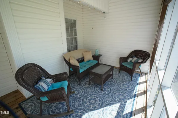 a living room with furniture and a rug