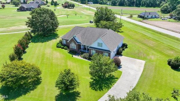a view of a swimming pool with a garden