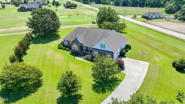 a view of a swimming pool with a garden