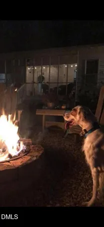 a room with water heater and wooden floor