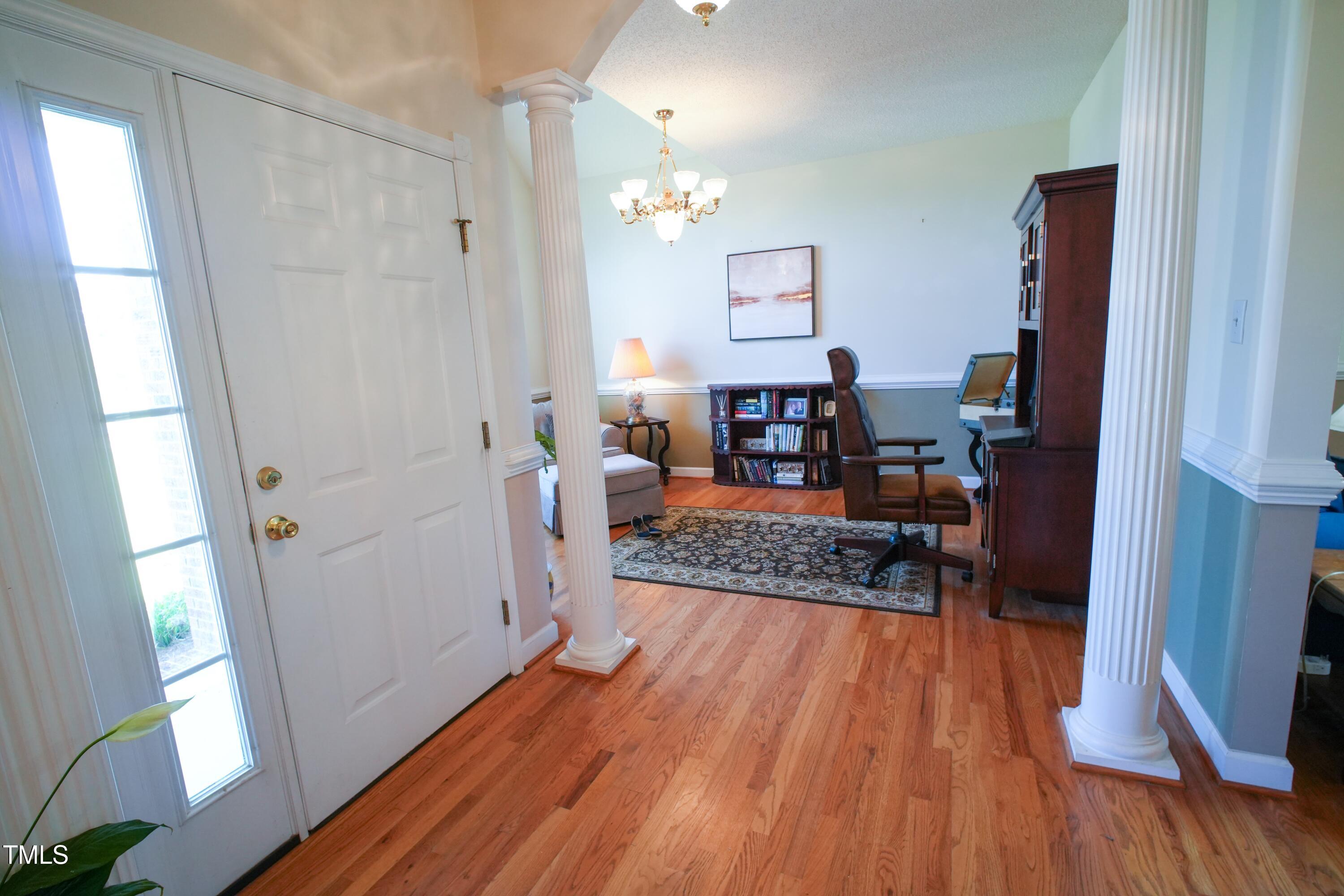 115 Hunters Walk Lane Clinton, NC 28328 - Photo 6 of 39 a living room with furniture and a wooden floor