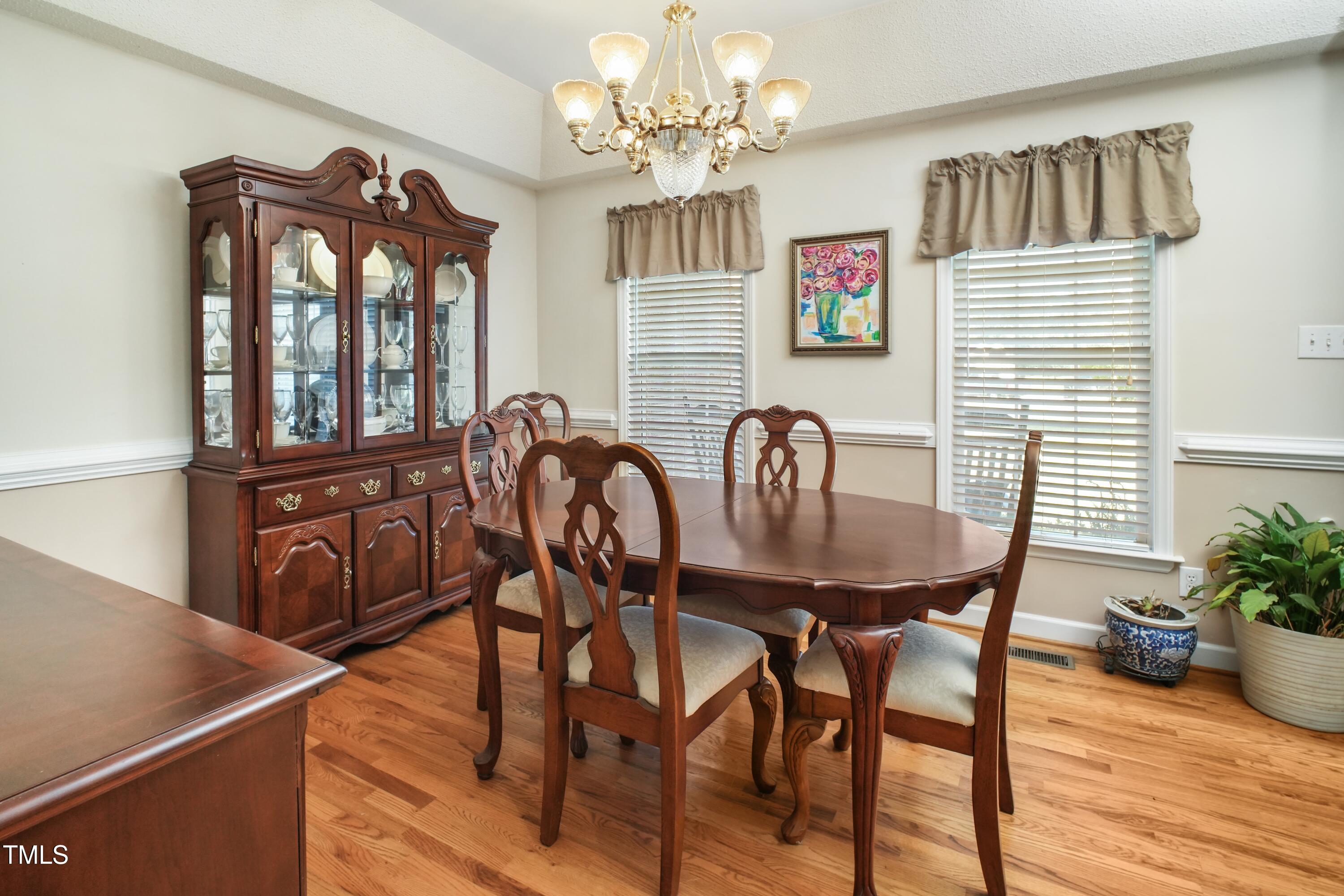 115 Hunters Walk Lane Clinton, NC 28328 - Photo 10 of 39 a view of a dining room with furniture window and wooden floor