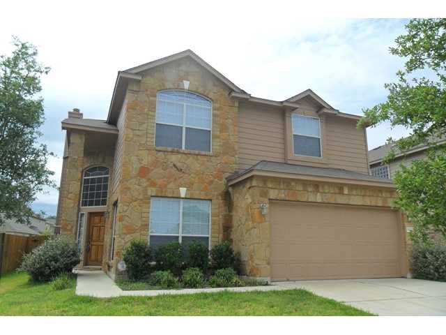 11112 Old Quarry Road Austin, TX 78717 - Photo 1 of 14 a front view of a house with a yard and trees