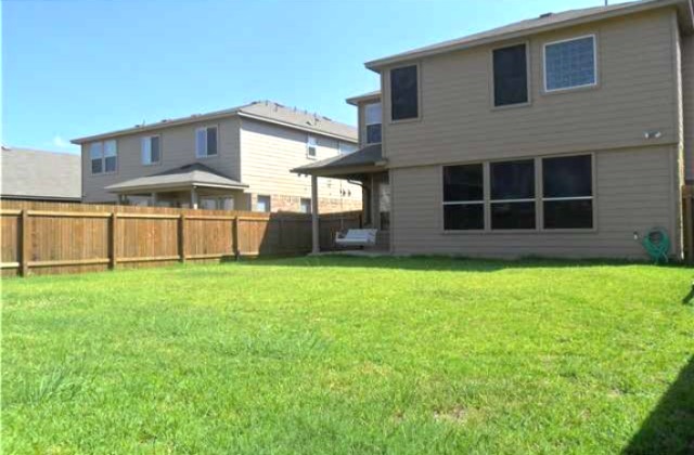 11112 Old Quarry Road Austin, TX 78717 - Photo 12 of 14 a front view of a house with a yard and garage