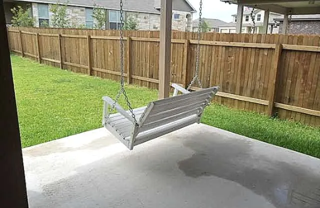 a view of backyard with tub