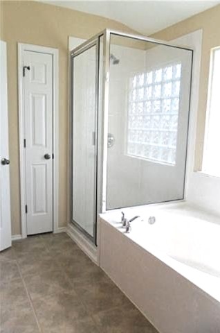 11112 Old Quarry Road Austin, TX 78717 - Photo 6 of 14 a bathroom with a bathtub and a shower