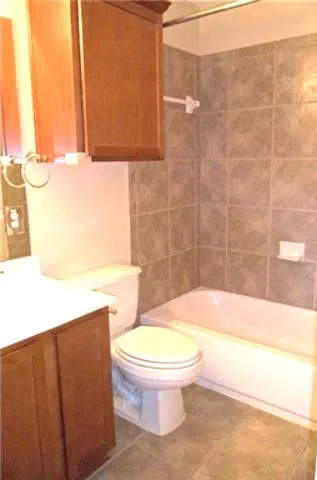 a bathroom with a toilet a sink and bathtub