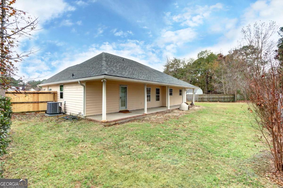 221 Oakwood Court Rincon, GA 31326 - Photo 32 of 35 a view of a house with a yard
