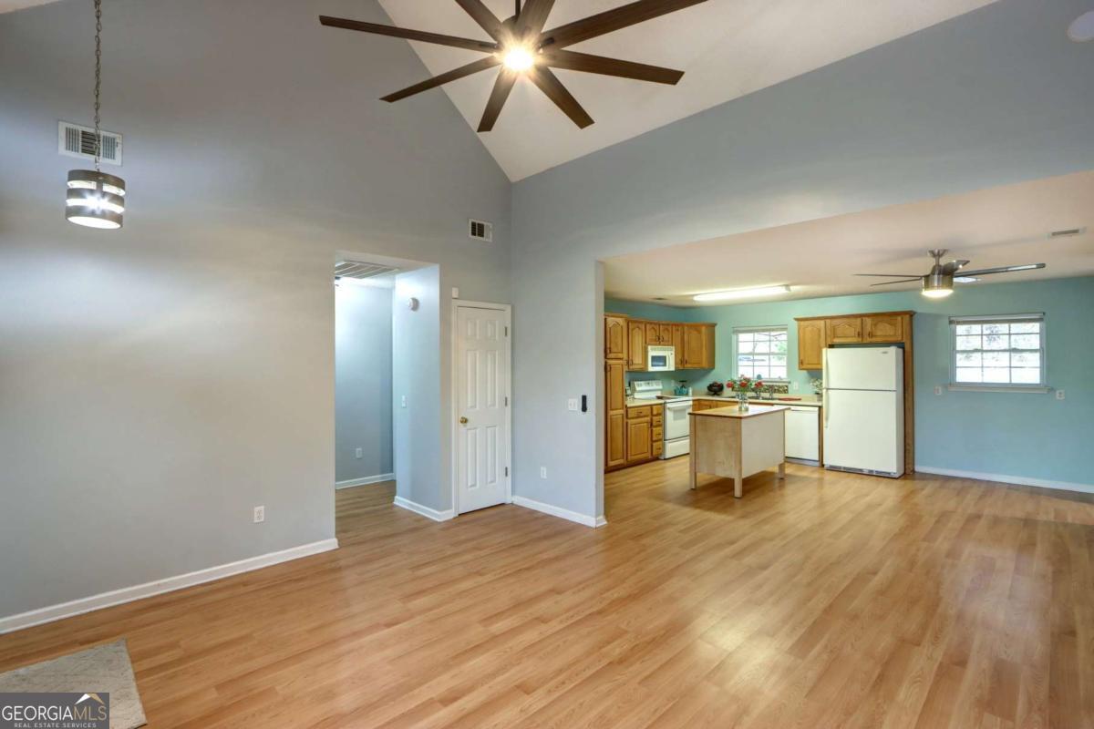 221 Oakwood Court Rincon, GA 31326 - Photo 5 of 35 a view of a kitchen with wooden floor and a sink