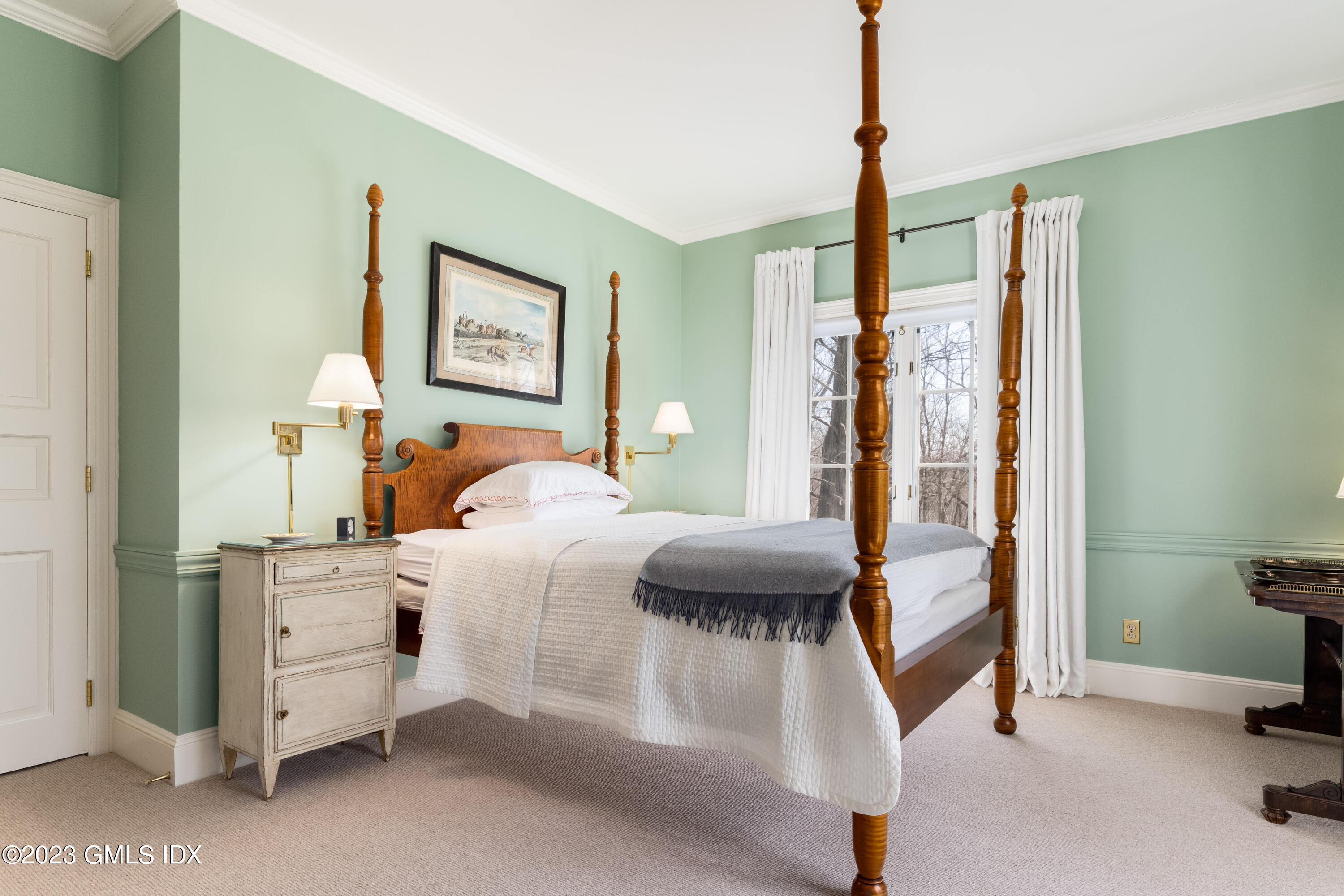 470 June Road Stamford, CT 06903 - Photo 14 of 26 a bedroom with a bed and a mirror