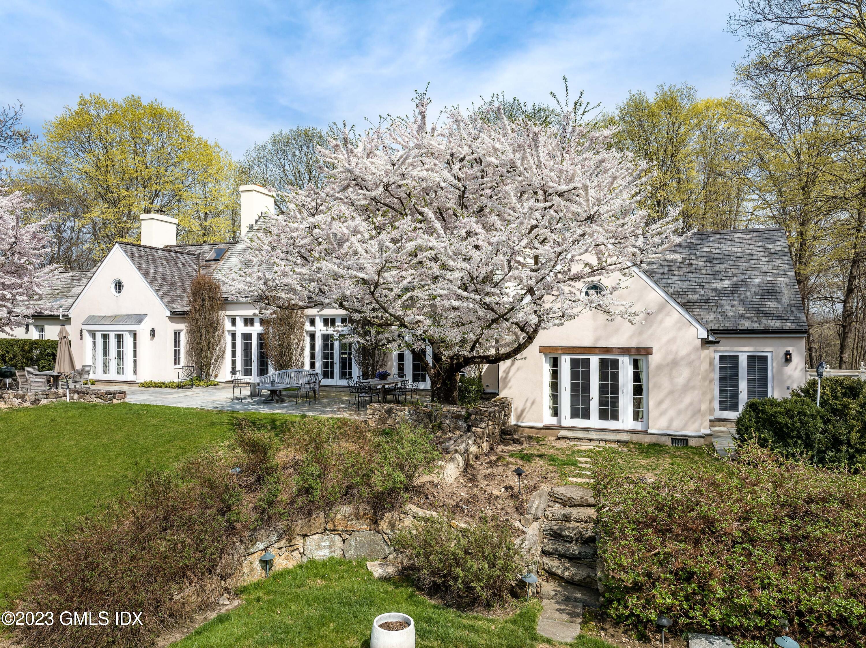 470 June Road Stamford, CT 06903 - Photo 15 of 26 a front view of a house with garden