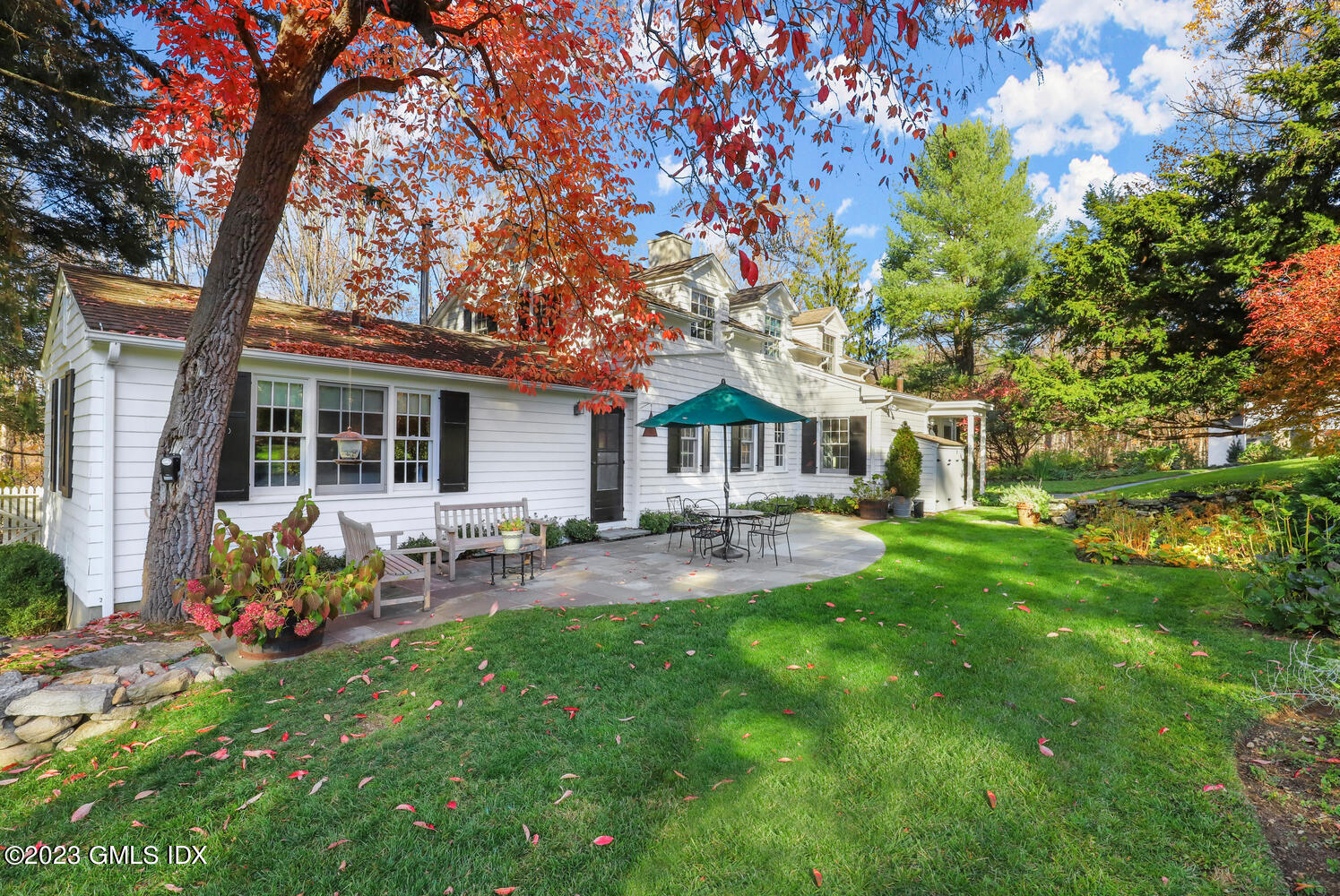 470 June Road Stamford, CT 06903 - Photo 18 of 26 a front view of house with yard and outdoor seating