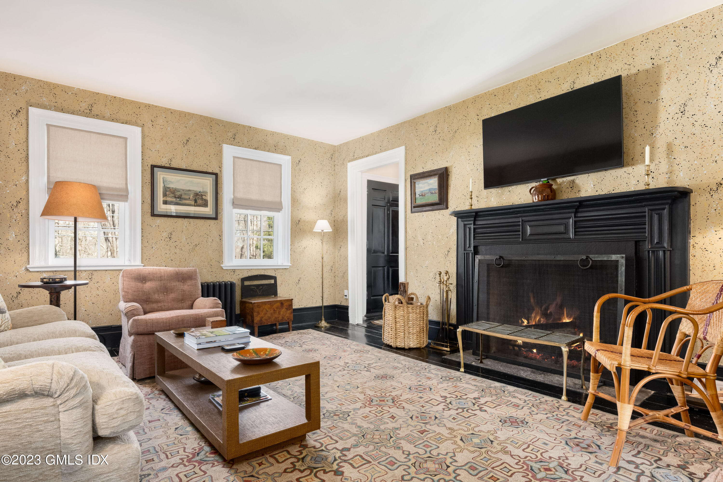 470 June Road Stamford, CT 06903 - Photo 19 of 26 a living room with furniture and a flat screen tv