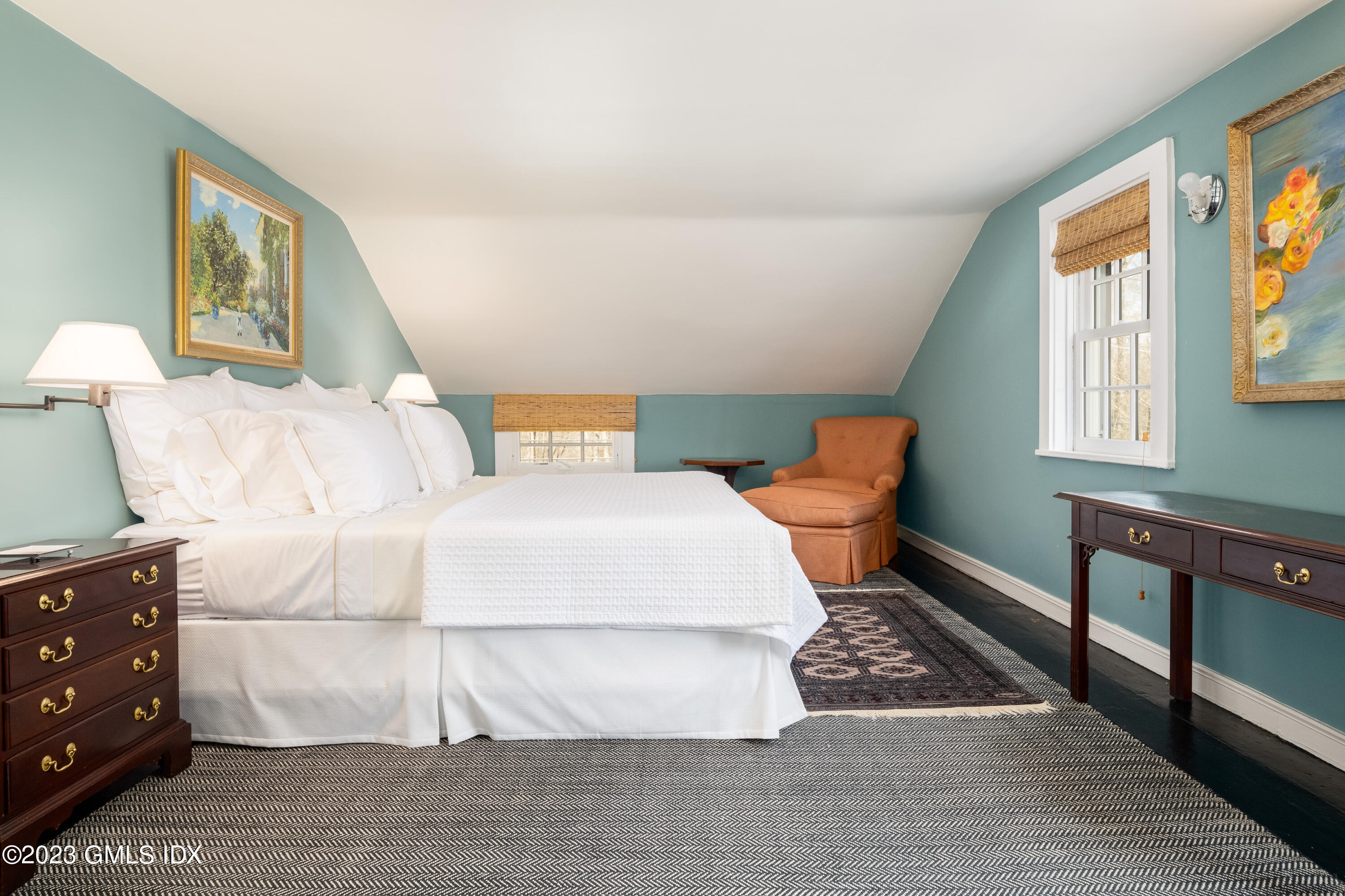 470 June Road Stamford, CT 06903 - Photo 24 of 26 a bedroom with a bed and wooden floor