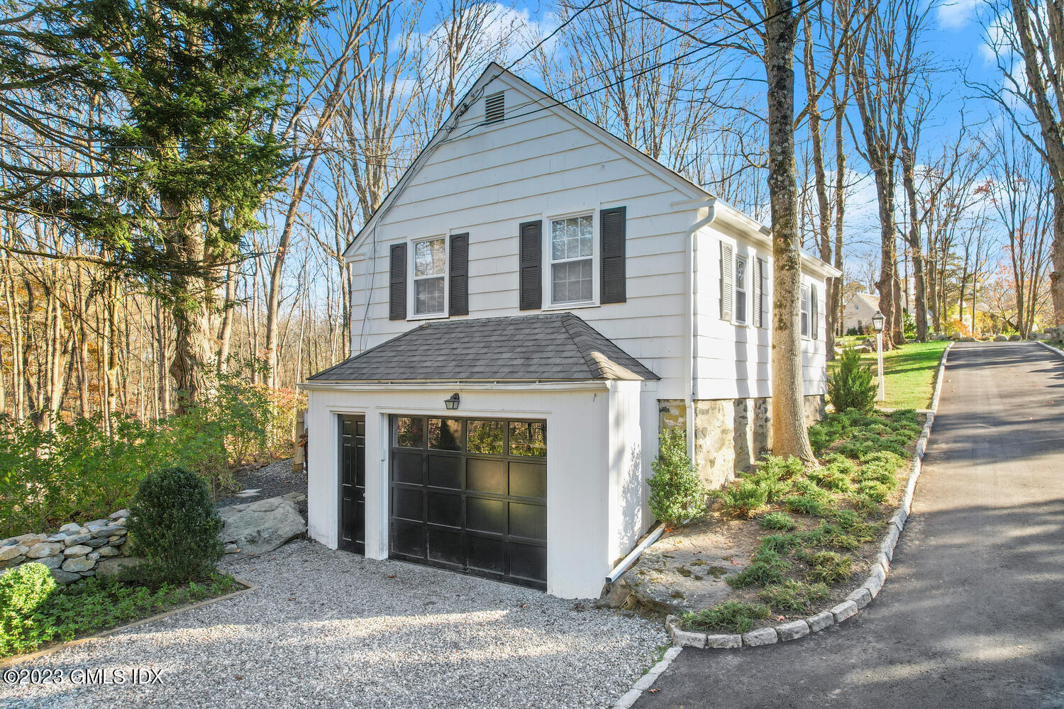 470 June Road Stamford, CT 06903 - Photo 26 of 26 a front view of a house with a garden
