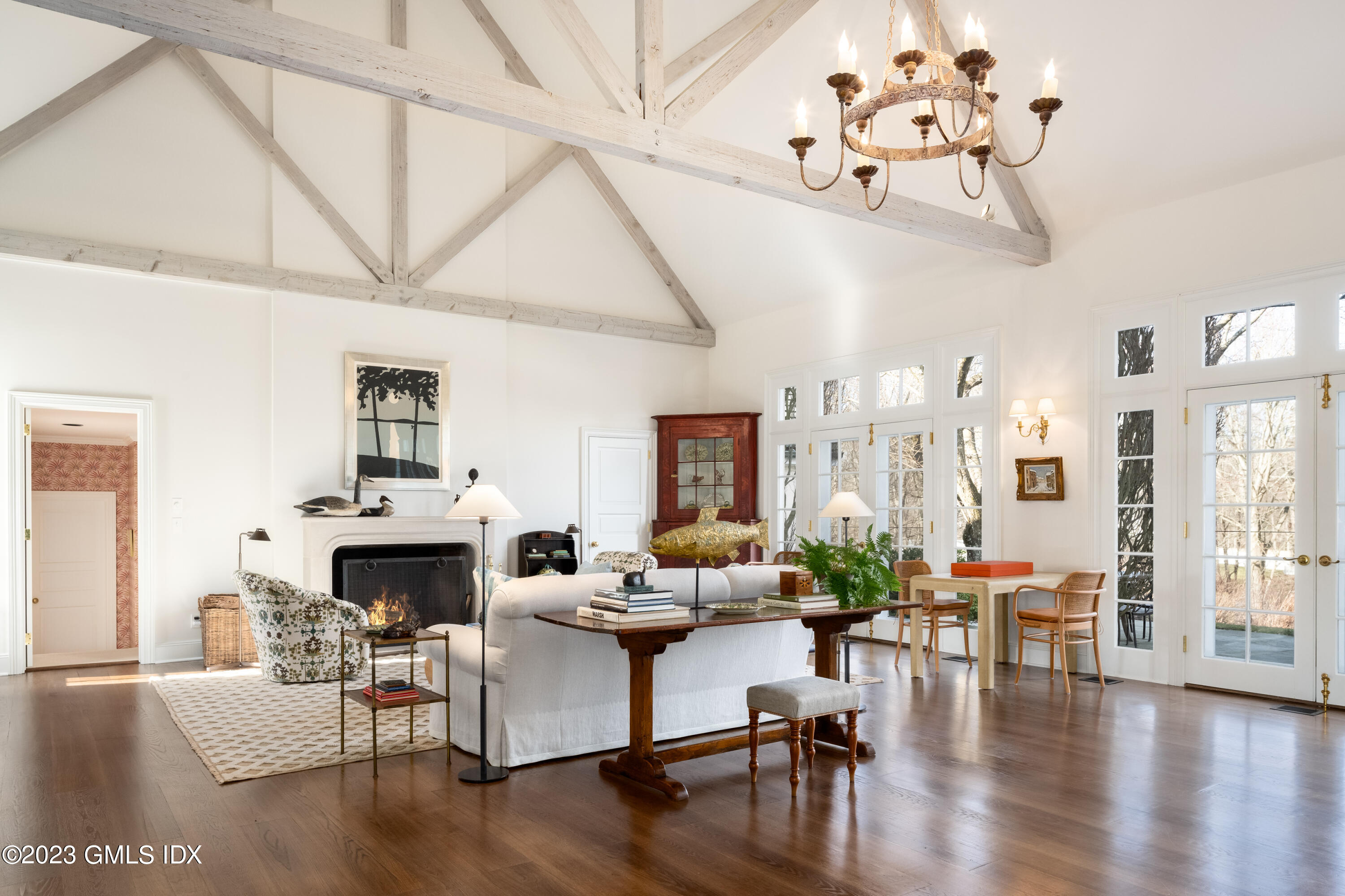 470 June Road Stamford, CT 06903 - Photo 5 of 26 a living room with furniture a fireplace and wooden floor