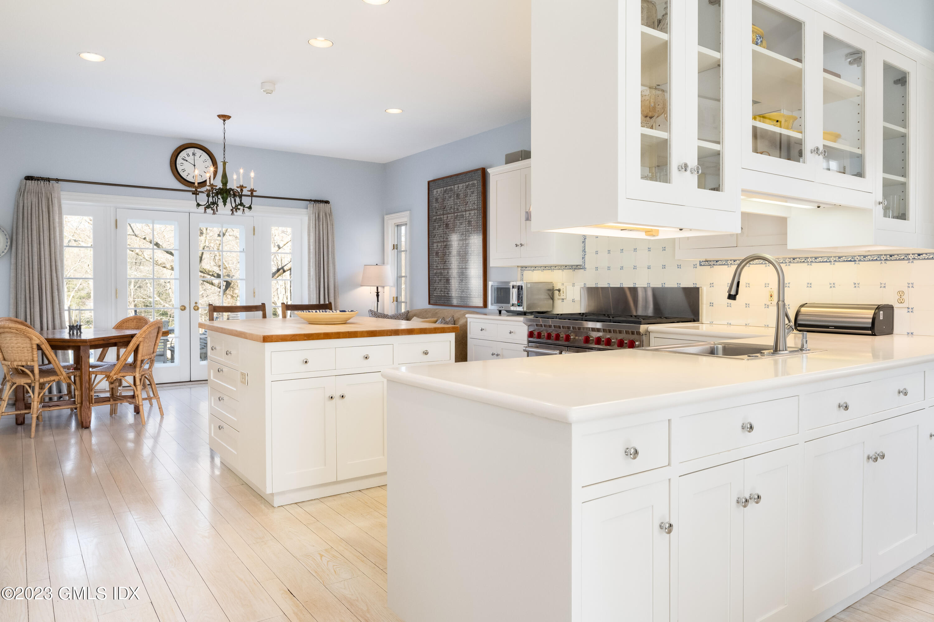 470 June Road Stamford, CT 06903 - Photo 8 of 26 a kitchen with white cabinets and sink