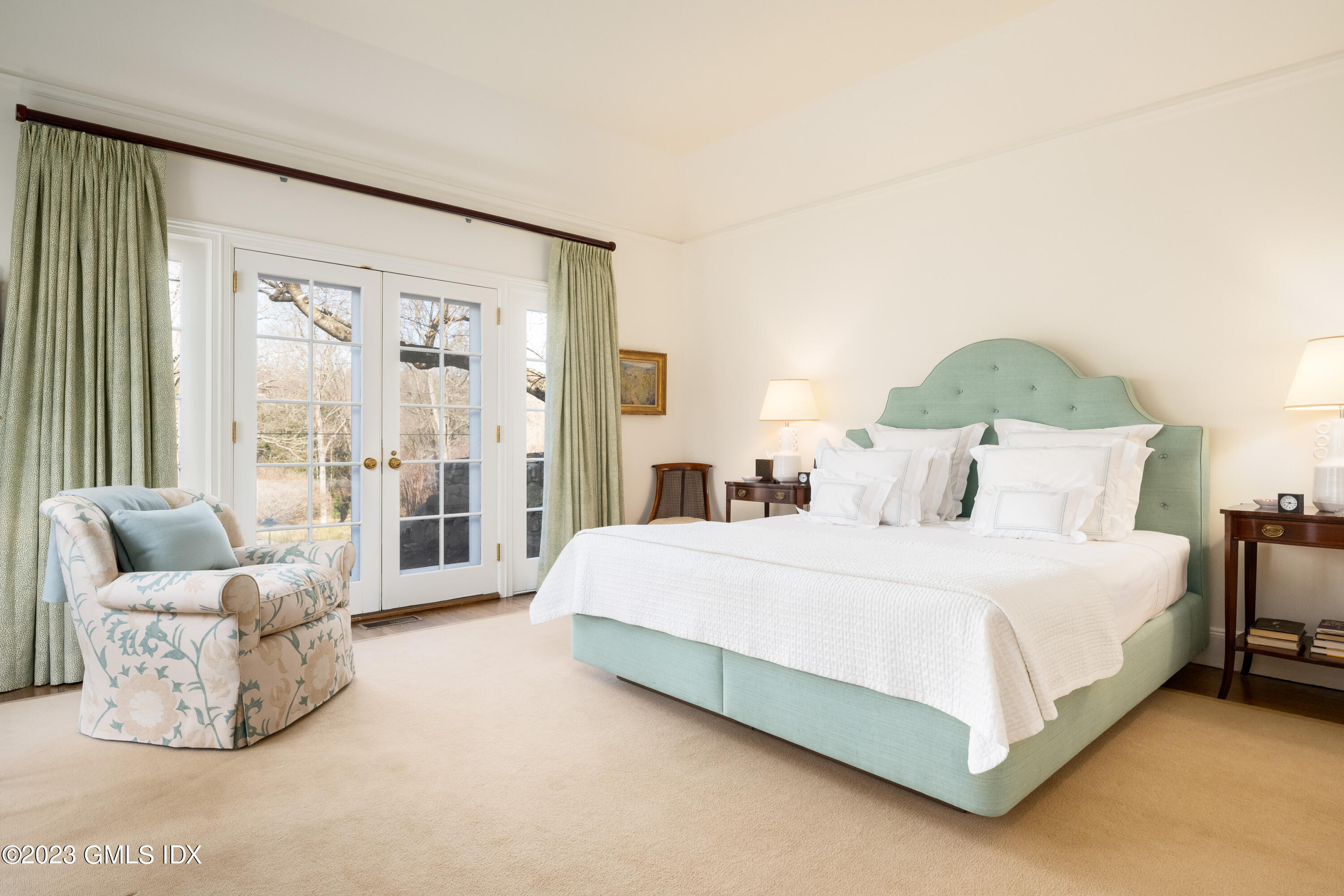 470 June Road Stamford, CT 06903 - Photo 10 of 26 a bedroom with a bed and glass walk in closet