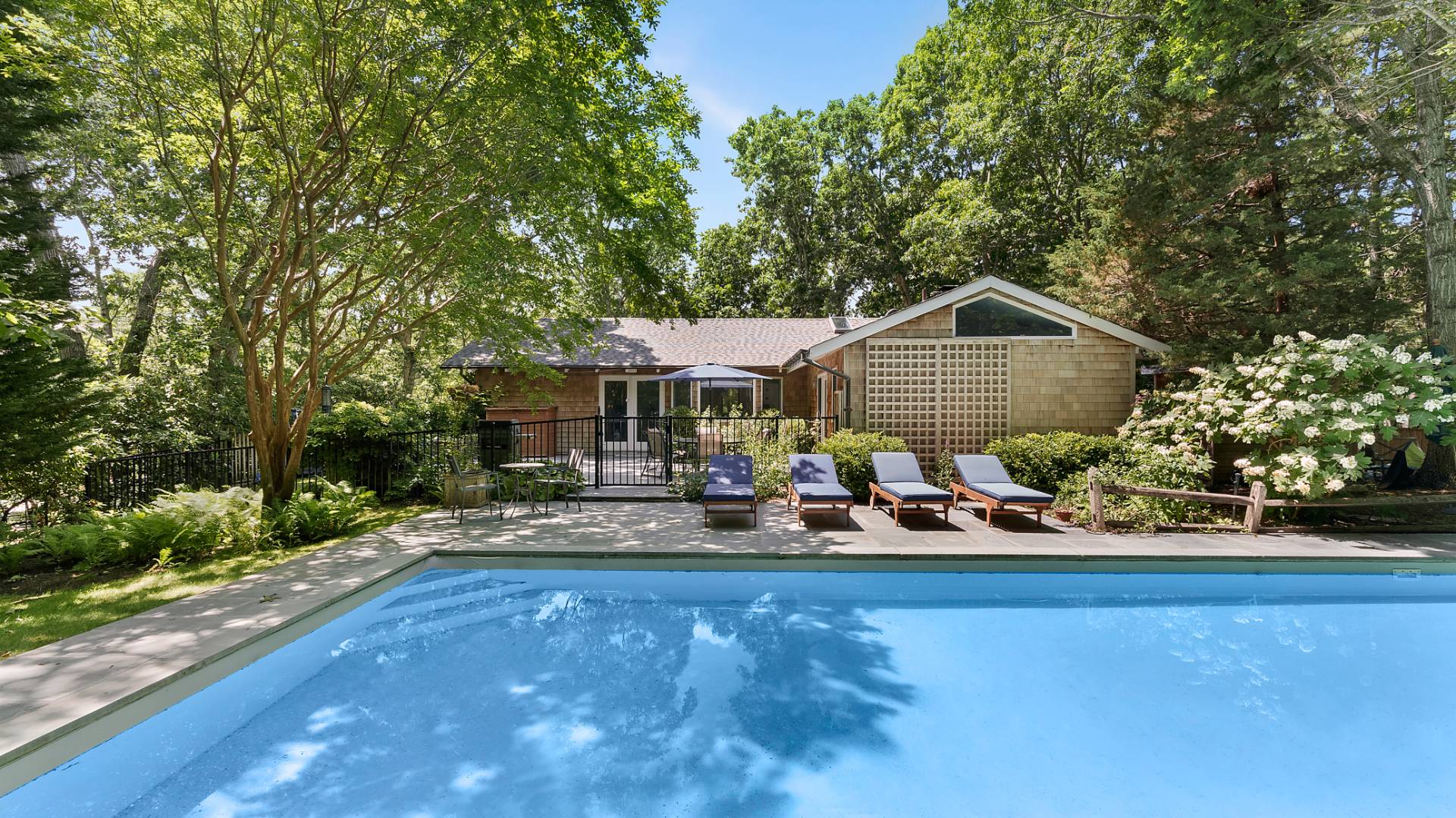 115 Isle Of Wight Road East Hampton, NY 11937 - Photo 11 of 14 a front view of a house with a yard