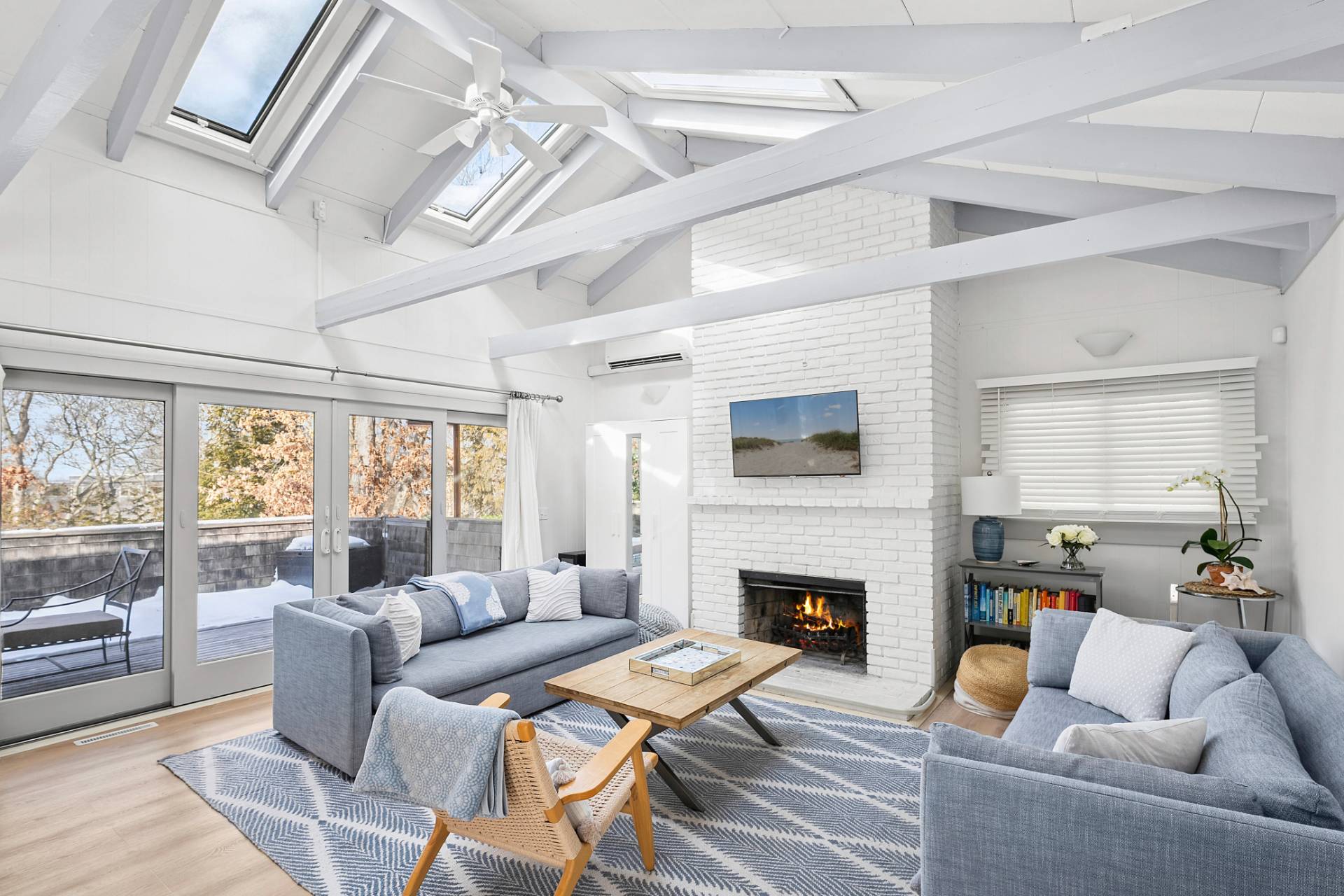 115 Isle Of Wight Road East Hampton, NY 11937 - Photo 3 of 14 a living room with furniture fireplace and a large window