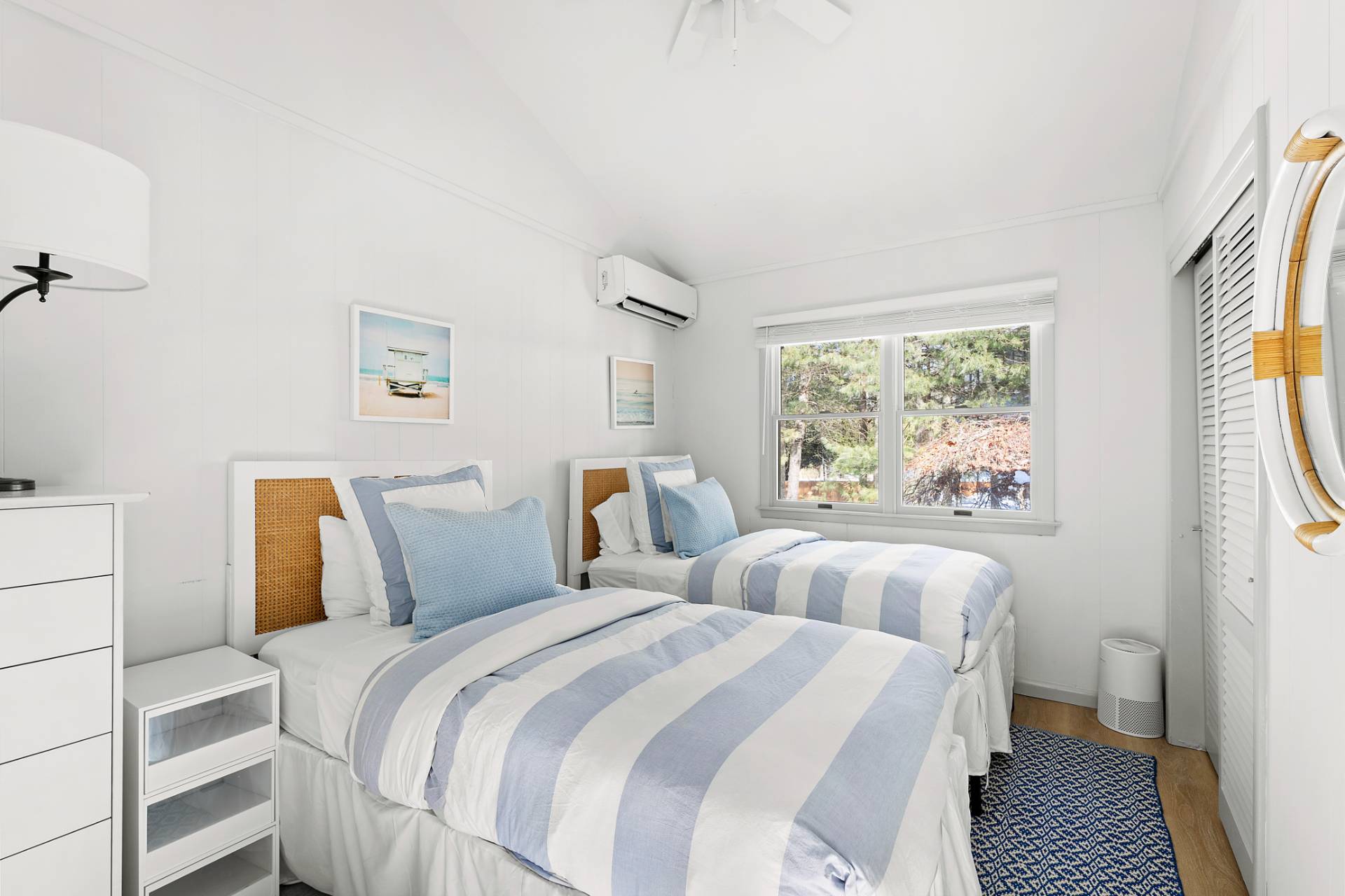 115 Isle Of Wight Road East Hampton, NY 11937 - Photo 10 of 14 a bedroom with two beds and a large window