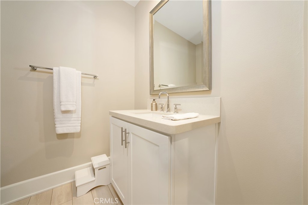 208 Villa Ridge Irvine, CA 92602 - Photo 11 of 46 a bathroom with a sink toilet and a mirror