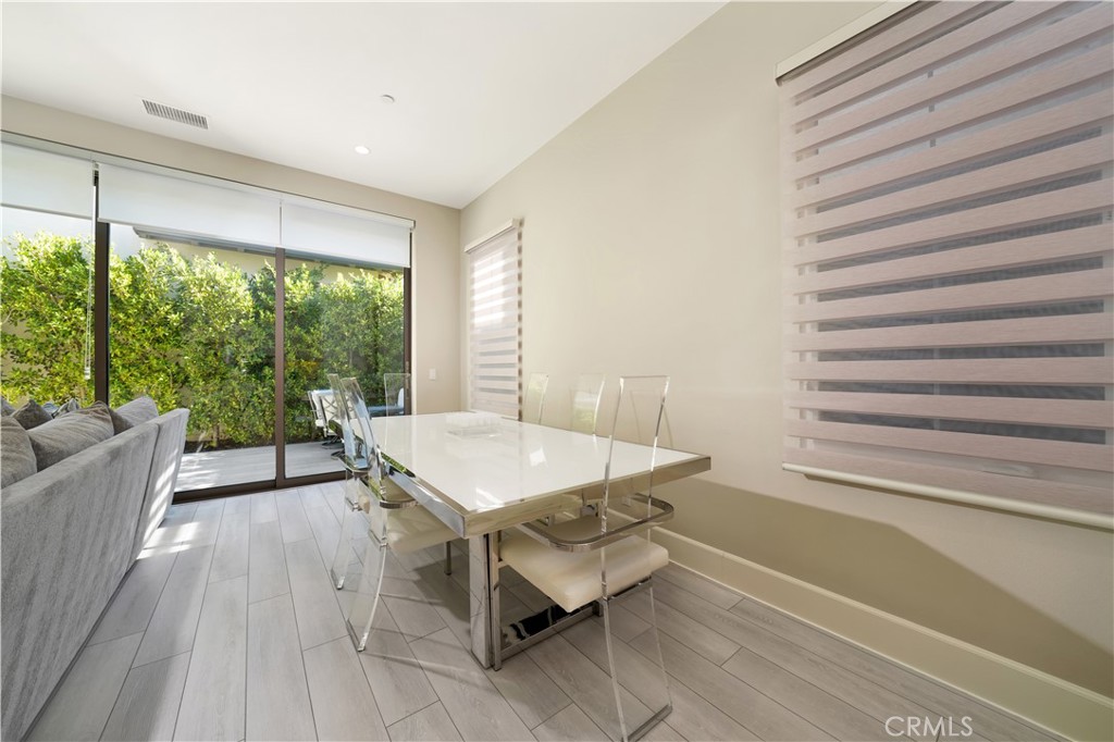 208 Villa Ridge Irvine, CA 92602 - Photo 22 of 46 a room with a table and a large window
