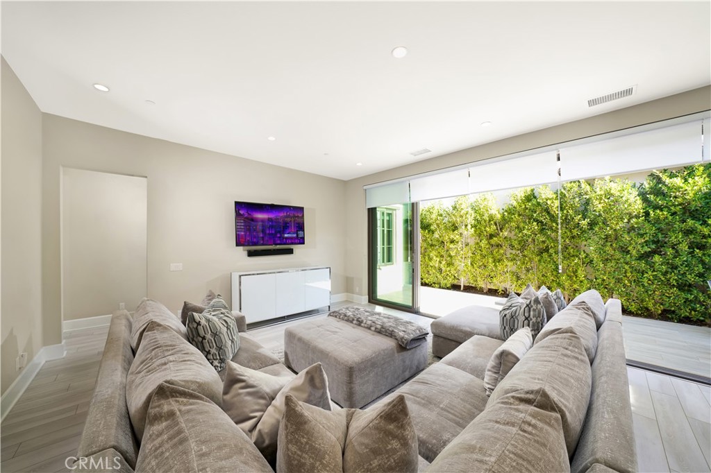 208 Villa Ridge Irvine, CA 92602 - Photo 23 of 46 a living room with furniture and a flat screen tv