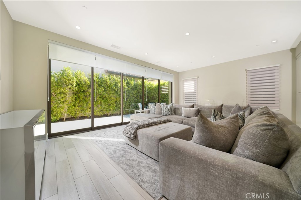 208 Villa Ridge Irvine, CA 92602 - Photo 25 of 46 a living room with furniture and a large window