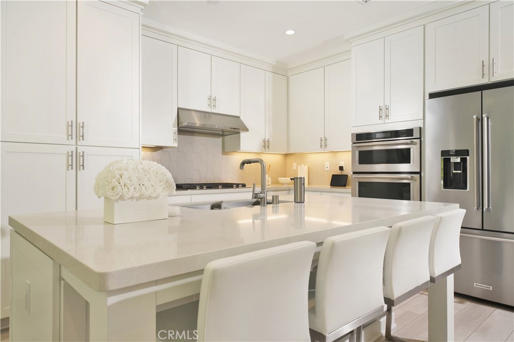 208 Villa Ridge Irvine, CA 92602 - Photo 27 of 46 a kitchen with stainless steel appliances a stove a sink and a refrigerator
