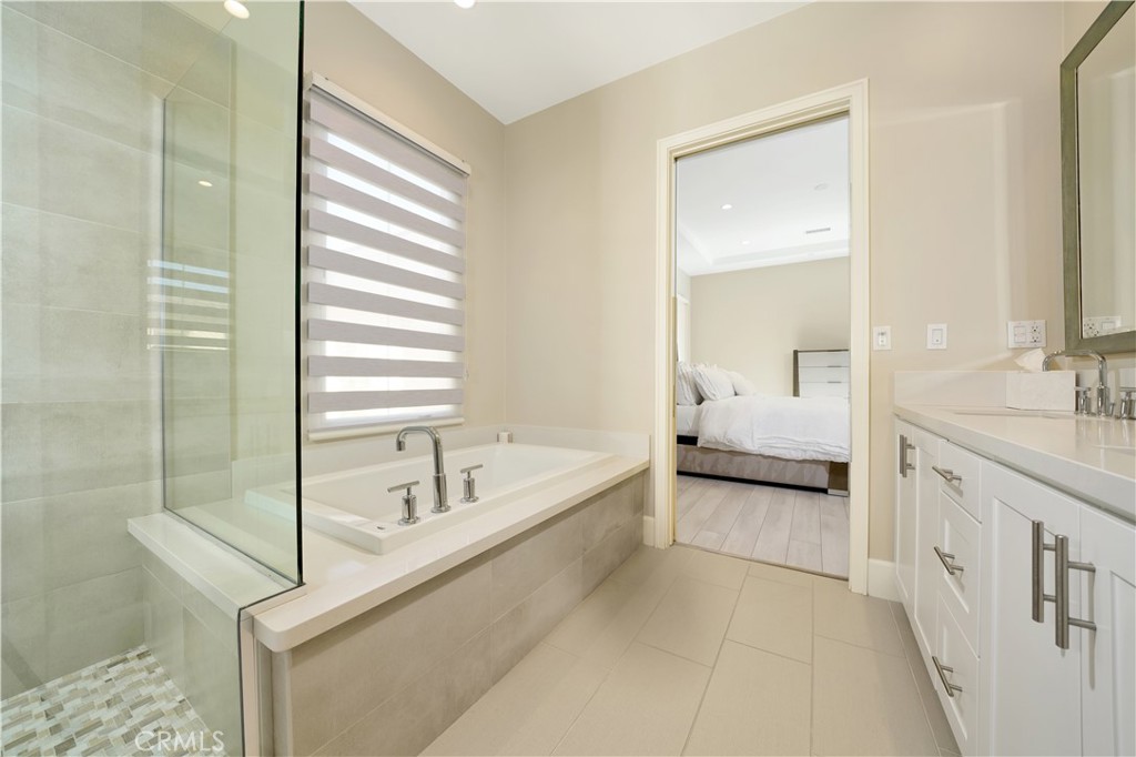 208 Villa Ridge Irvine, CA 92602 - Photo 31 of 46 a spacious bathroom with a tub sink and vanity