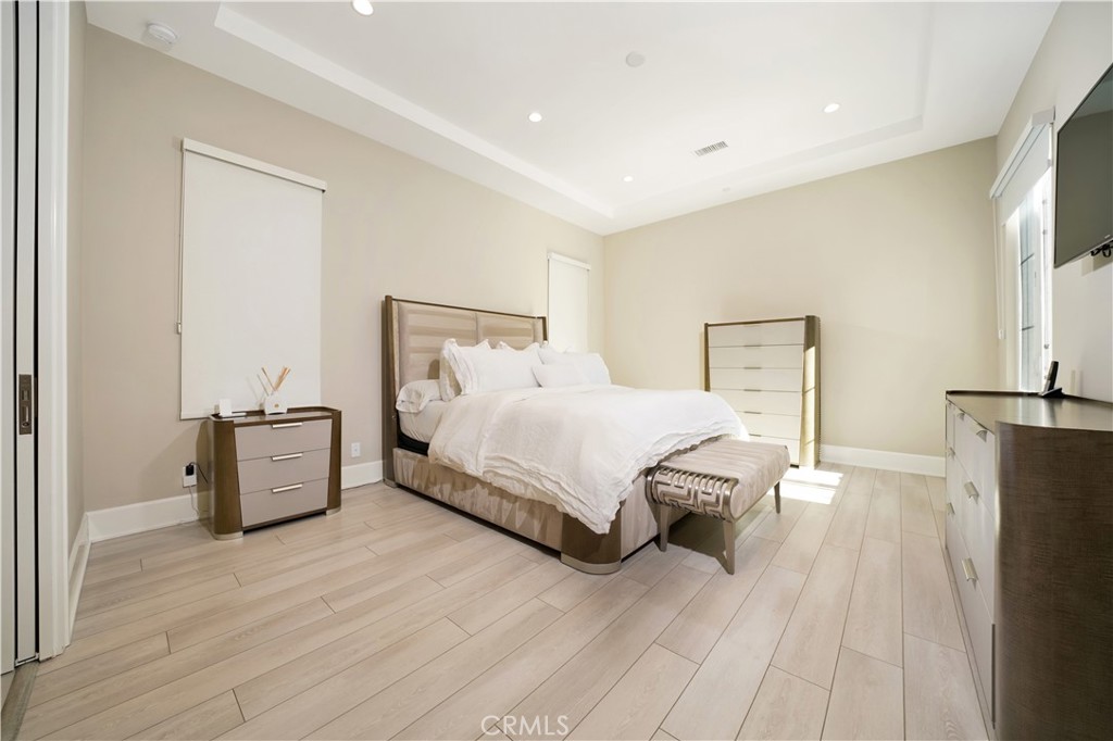 208 Villa Ridge Irvine, CA 92602 - Photo 36 of 46 a bedroom with a bed and a dresser