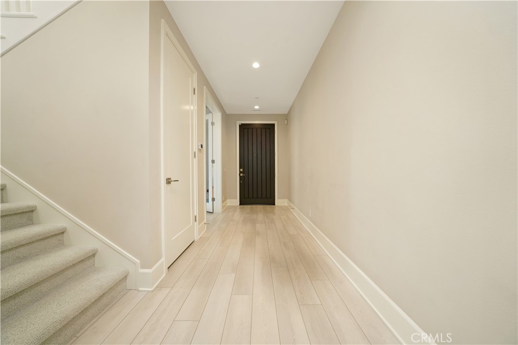 208 Villa Ridge Irvine, CA 92602 - Photo 37 of 46 a view of a hallway with wooden floor