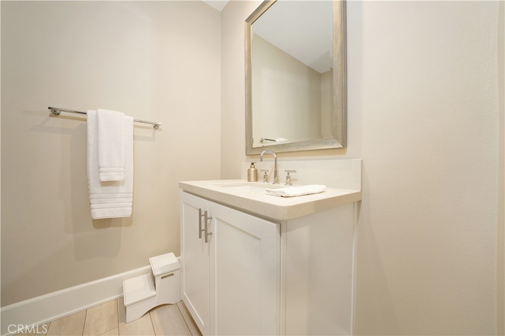 208 Villa Ridge Irvine, CA 92602 - Photo 38 of 46 a bathroom with a sink toilet and a mirror