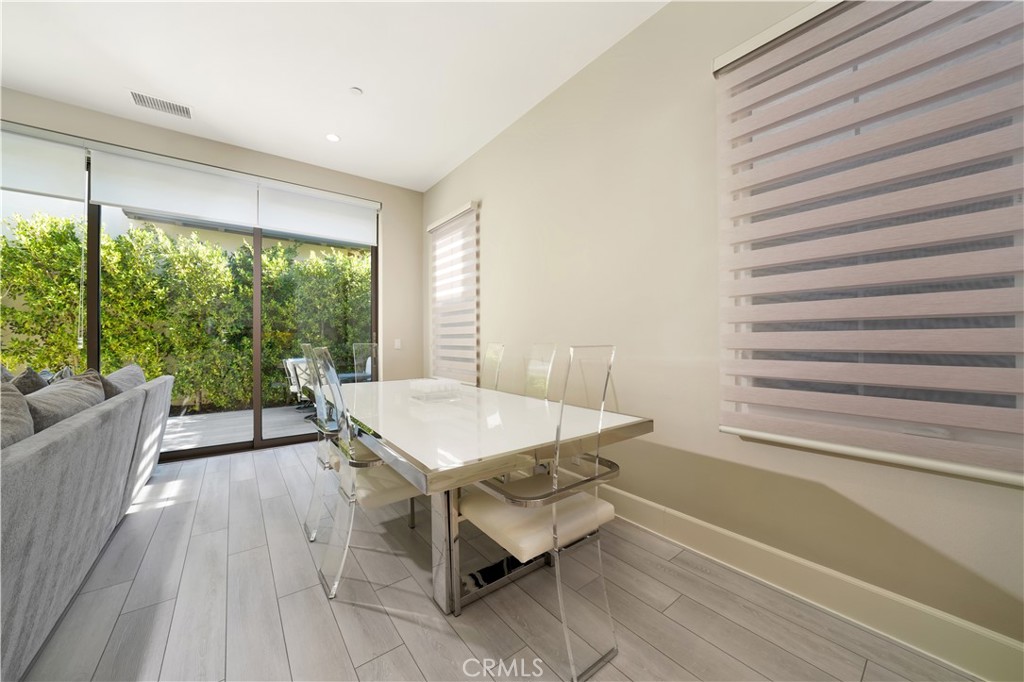 208 Villa Ridge Irvine, CA 92602 - Photo 44 of 46 a room with a table and a large window
