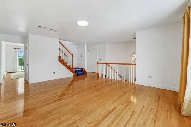 a view of an entryway with wooden floor
