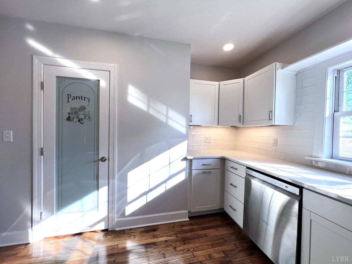 5235 Wards Fork Mill Road Cullen, VA 23934 - Photo 15 of 42 a kitchen with a sink cabinets and wooden floor