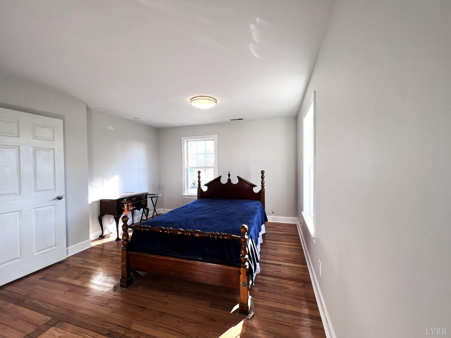 5235 Wards Fork Mill Road Cullen, VA 23934 - Photo 19 of 42 a bed room with a bed and a window