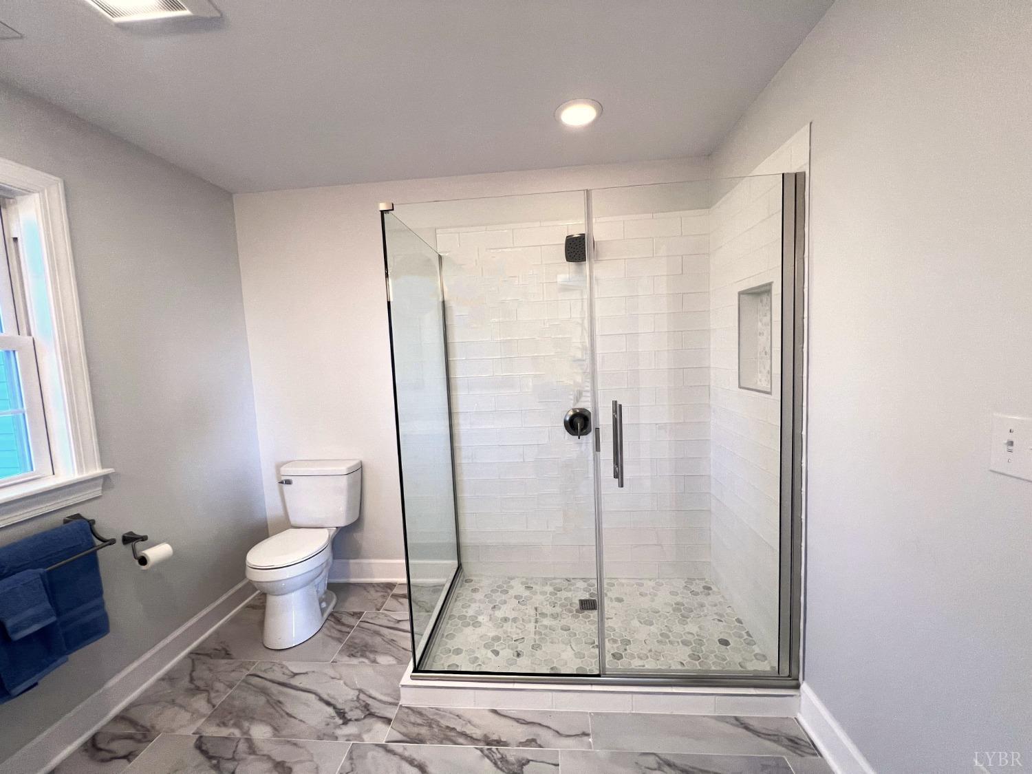 5235 Wards Fork Mill Road Cullen, VA 23934 - Photo 22 of 42 a bathroom with a shower toilet and sink