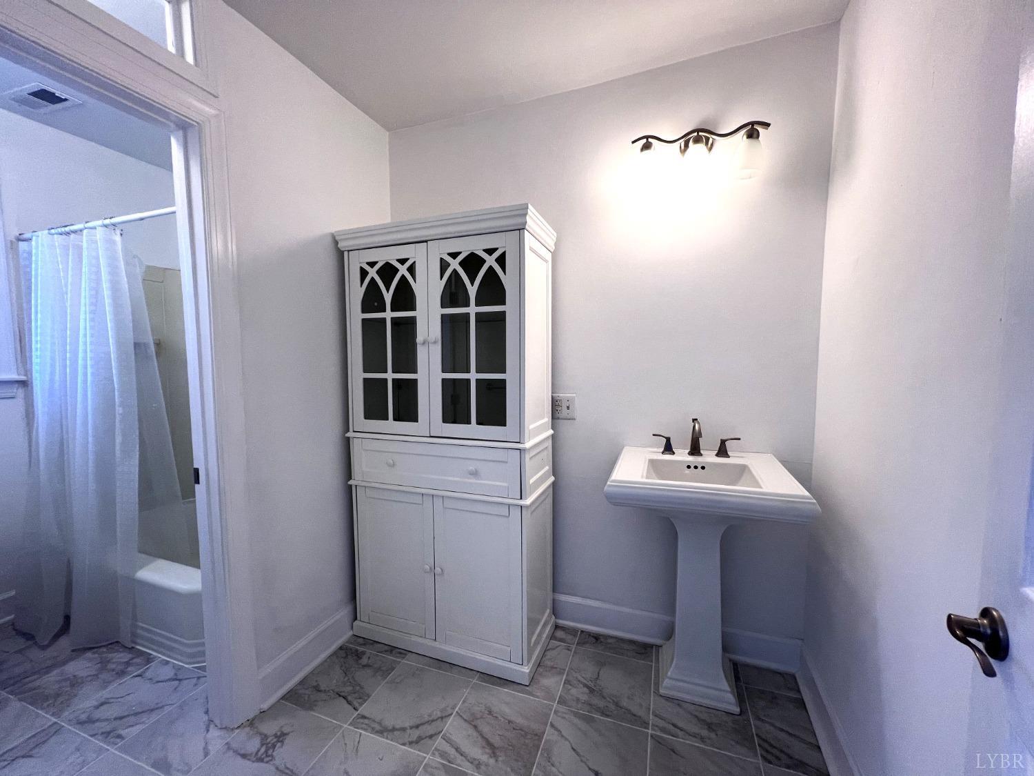 5235 Wards Fork Mill Road Cullen, VA 23934 - Photo 28 of 42 a bathroom with sink and mirror