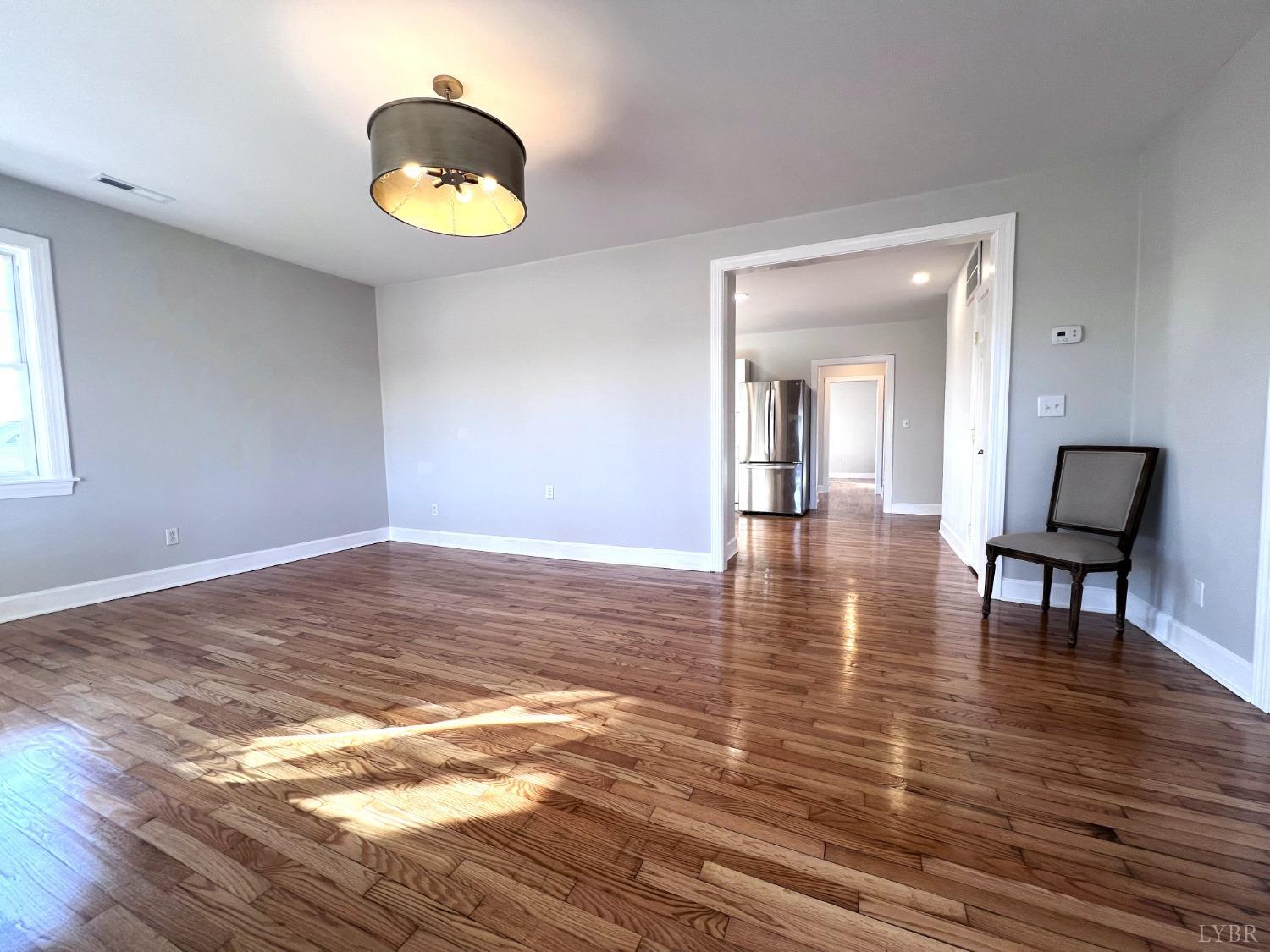 5235 Wards Fork Mill Road Cullen, VA 23934 - Photo 10 of 42 a view of a room with wooden floor and furniture