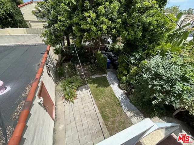 a view of balcony with yard