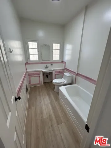 a view of kitchen with furniture and wooden floor