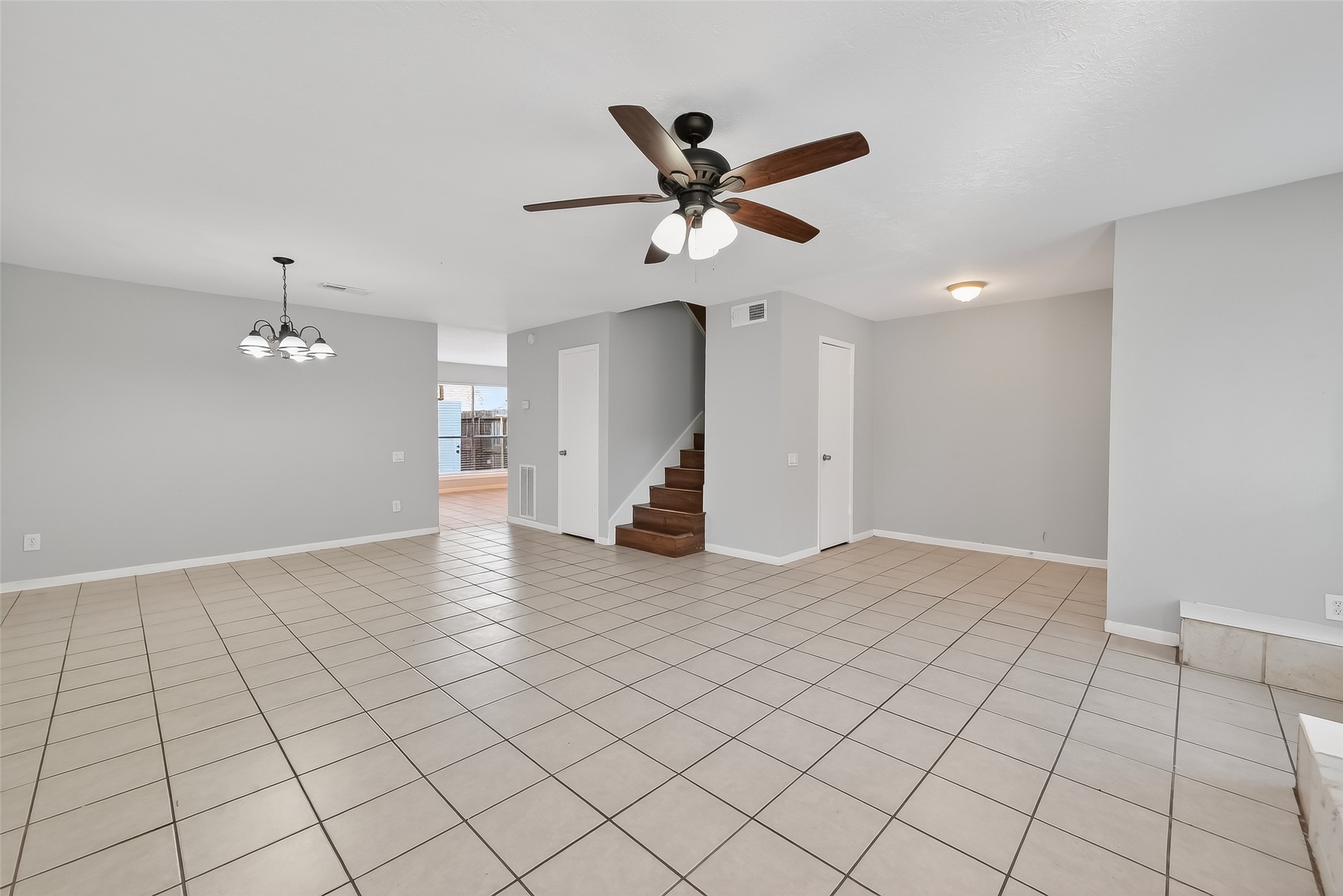 8646 Maplecrest Drive Houston, TX 77099 - Photo 11 of 36 a view of empty room with wooden floor and fan