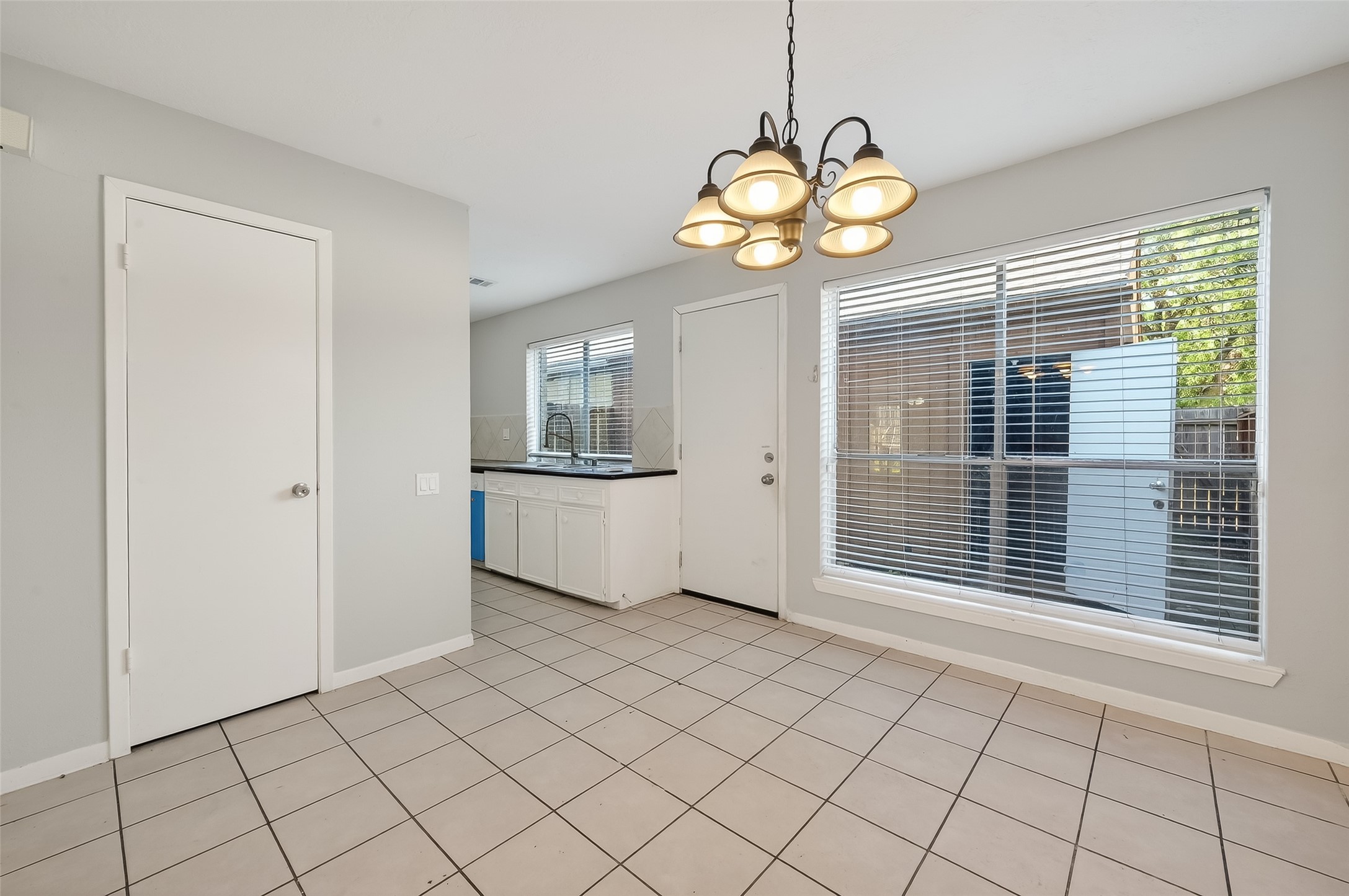 8646 Maplecrest Drive Houston, TX 77099 - Photo 13 of 36 a view of an empty room with a window and wooden floor