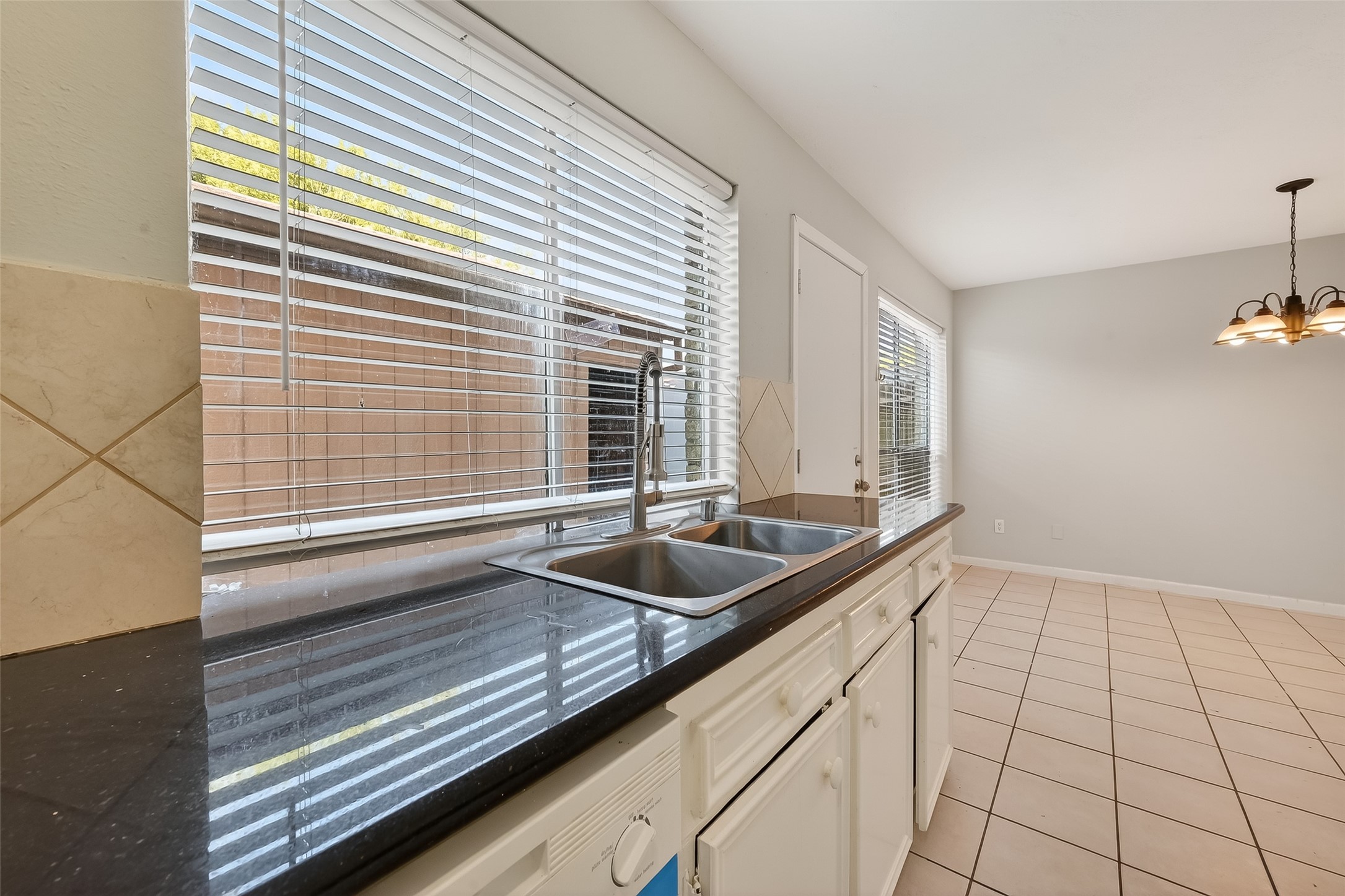 8646 Maplecrest Drive Houston, TX 77099 - Photo 16 of 36 a bathroom with a sink and a large mirror