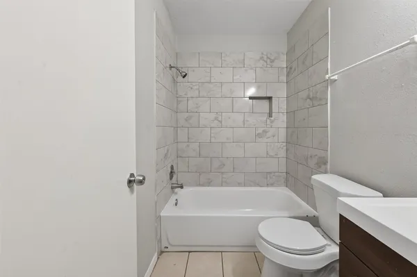 a bathroom with a sink toilet and bathtub
