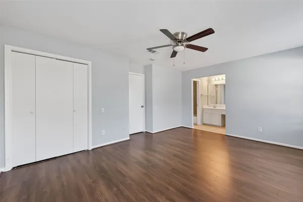 a bathroom with a bathtub a sink a toilet and a mirror