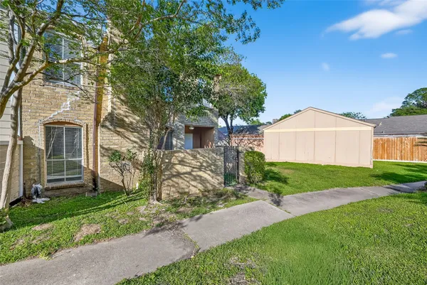 a view of a back yard of the house